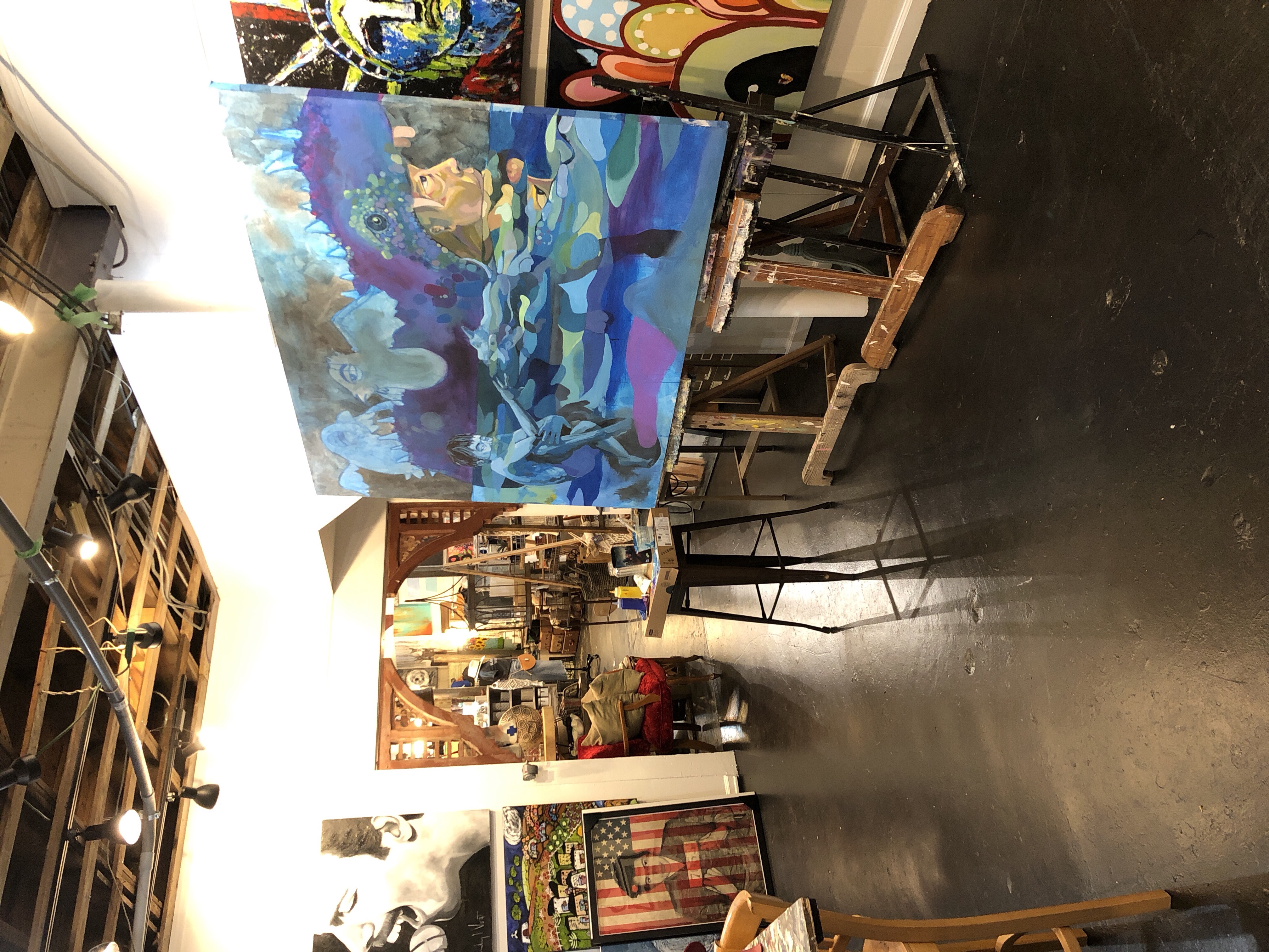 Interior photo of the painting on an easel. at the shop Sis and Moons.